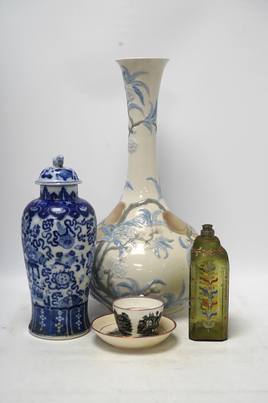 Four ceramic items including a large Lladro vase, 47.5cm high, a Chinese lidded vase, an early 19th century painted bottle and a lustre teacup and saucer. Condition - fair to good